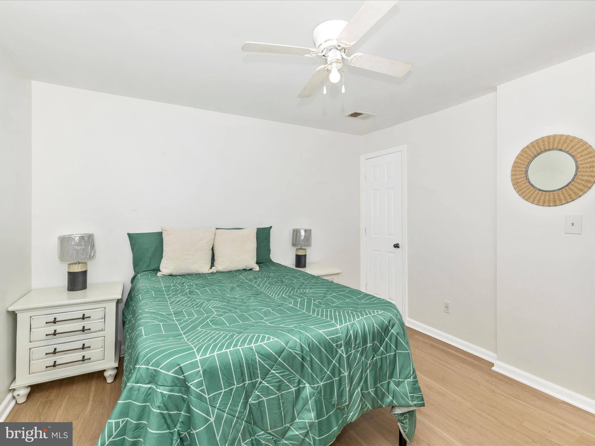 1410 Woodenbridge Lane Mount Airy, MD 21771 - Photo 26 of 50 a bedroom with a bed and a chandelier