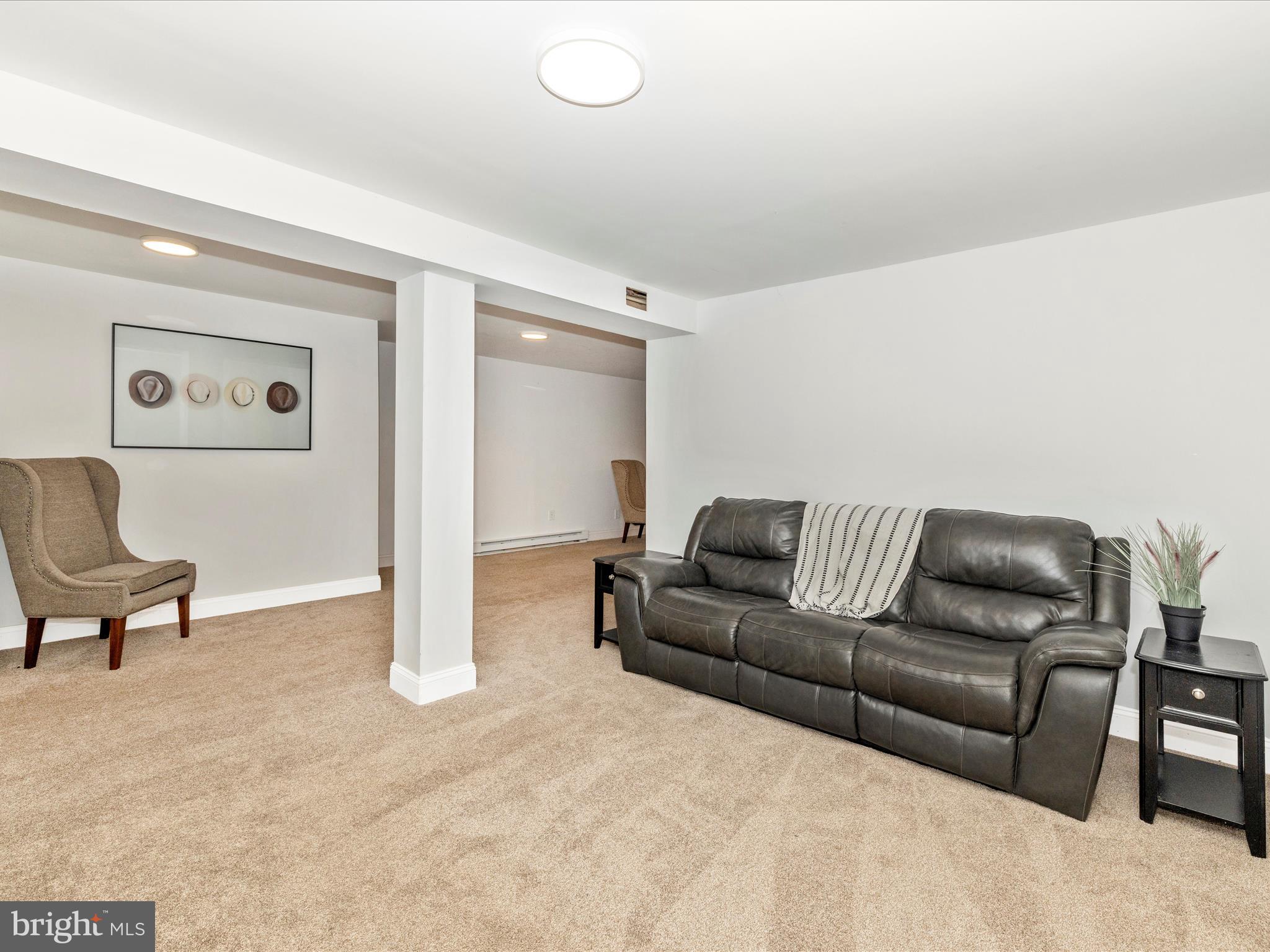 1410 Woodenbridge Lane Mount Airy, MD 21771 - Photo 32 of 50 a living room with furniture