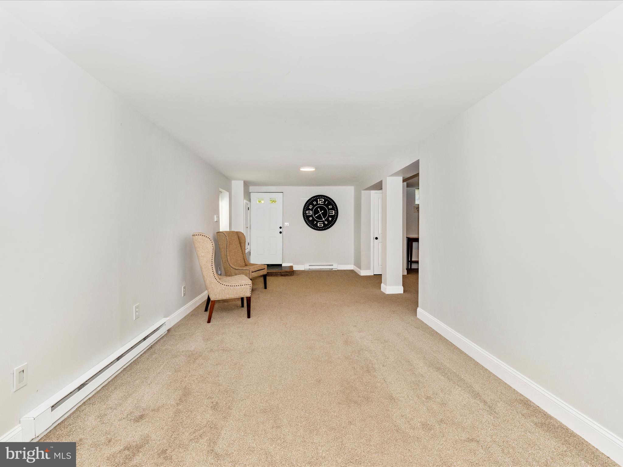 1410 Woodenbridge Lane Mount Airy, MD 21771 - Photo 33 of 50 a area with a table and a chair