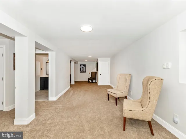 a view of a livingroom with furniture and a chair