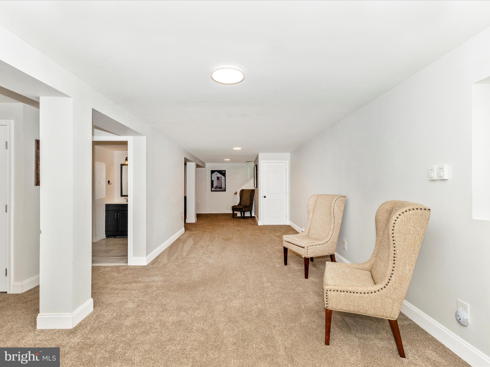 1410 Woodenbridge Lane Mount Airy, MD 21771 - Photo 34 of 50 a view of a livingroom with furniture and a chair