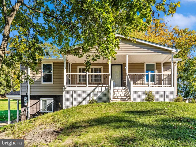 a view of house with yard
