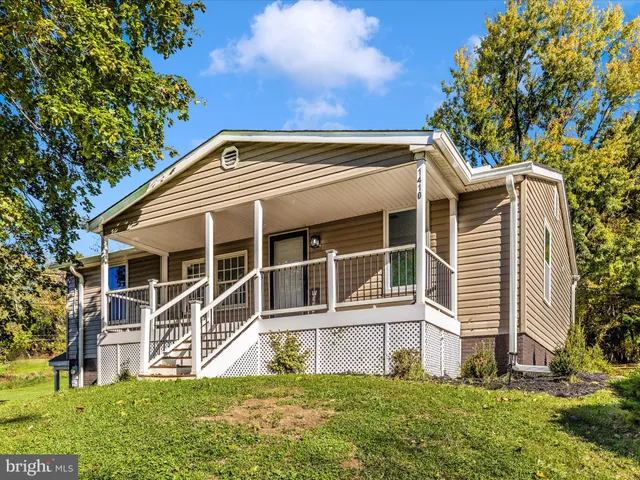a view of house with yard