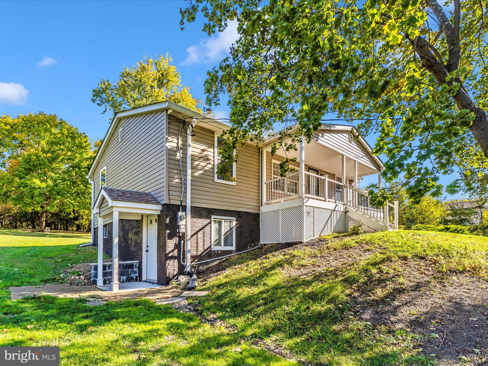1410 Woodenbridge Lane Mount Airy, MD 21771 - Photo 44 of 50 a front view of a house with a garden