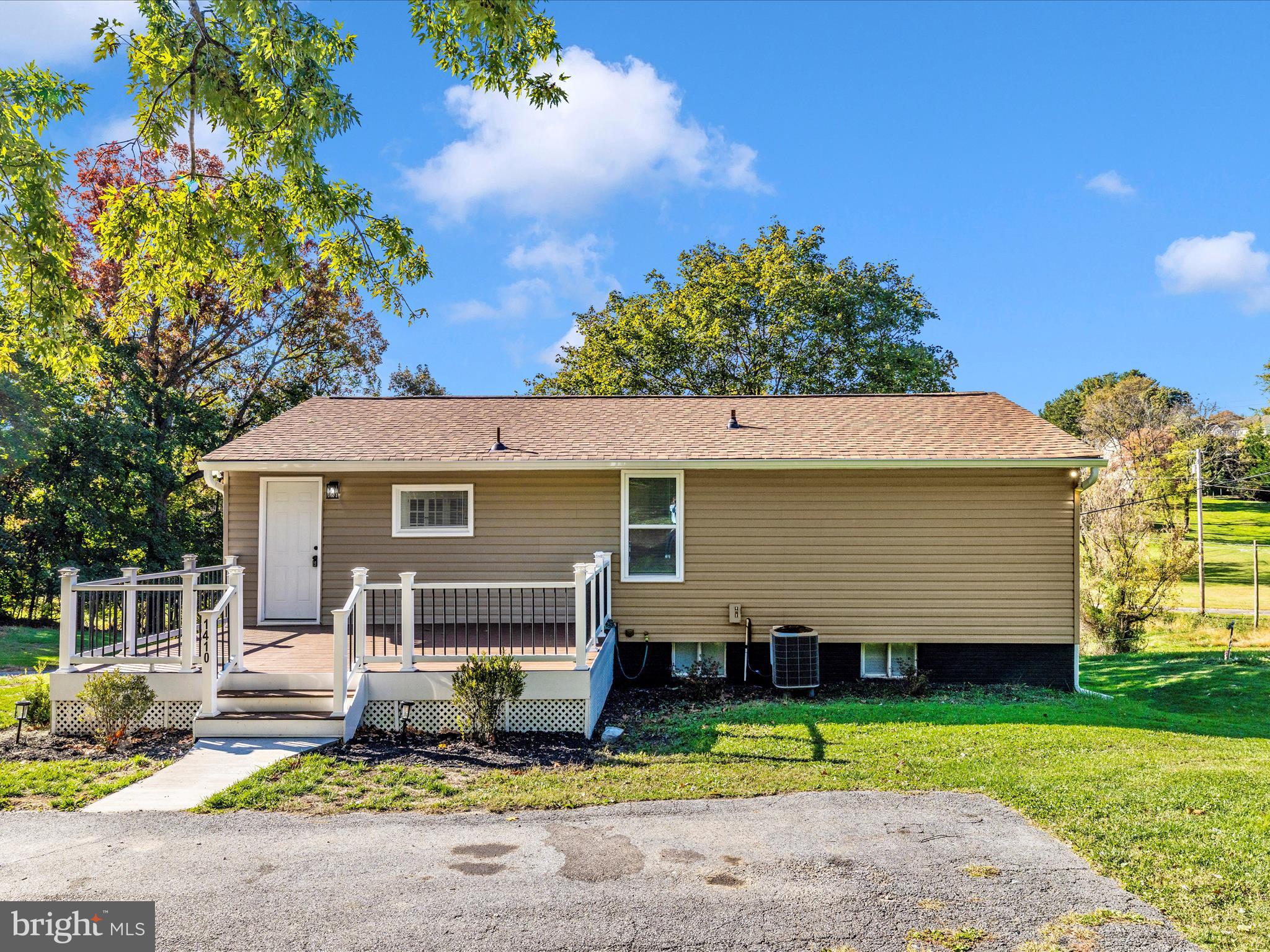 1410 Woodenbridge Lane Mount Airy, MD 21771 - Photo 45 of 50 front view of a house with a yard