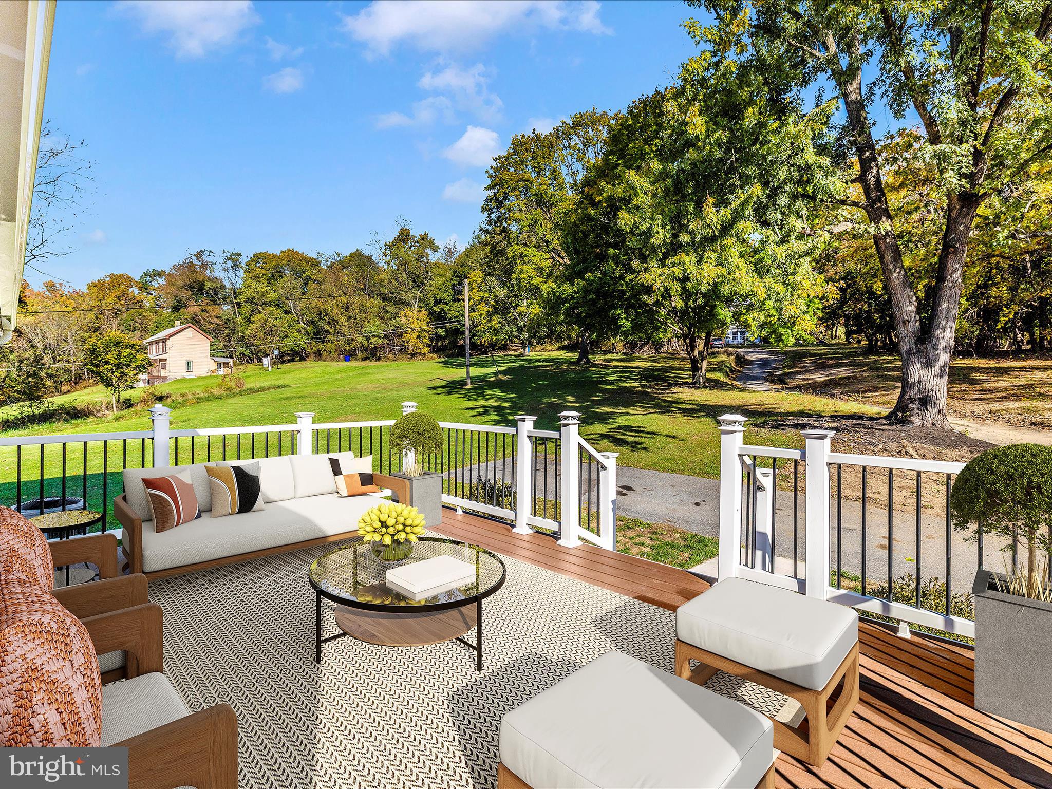 1410 Woodenbridge Lane Mount Airy, MD 21771 - Photo 48 of 50 a view of a patio with couches potted plants and ocean view