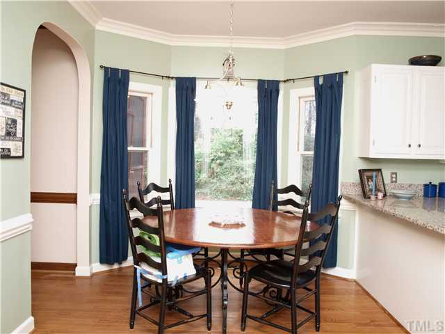 8305 Mourning Dove Road Raleigh, NC 27615 - Photo 8 of 24 Breakfast Area with bay window and arched entry to Family Room