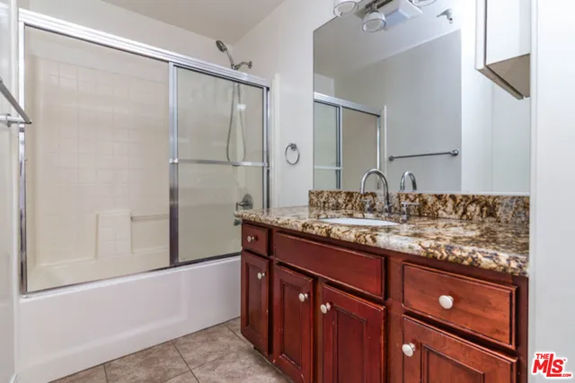 a bathroom with a shower and a toilet