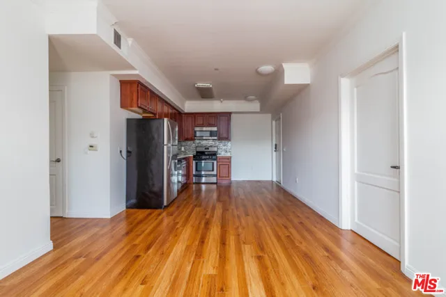 a view of kitchen and wooden floor