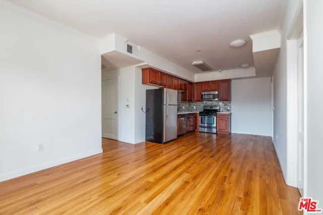 a view of kitchen with furniture and wooden floor