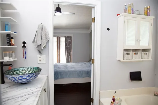 a bedroom with a bed and a window