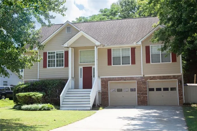 a front view of a house with a yard