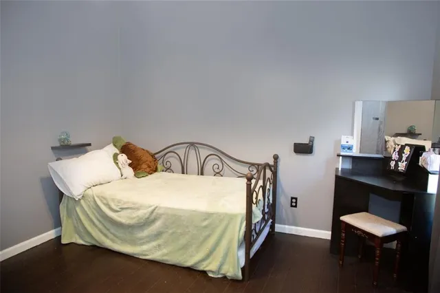 a bedroom with a bed and a table in it