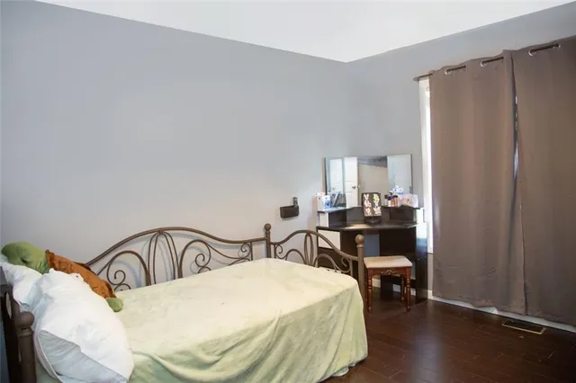 a bedroom with a bed and a table