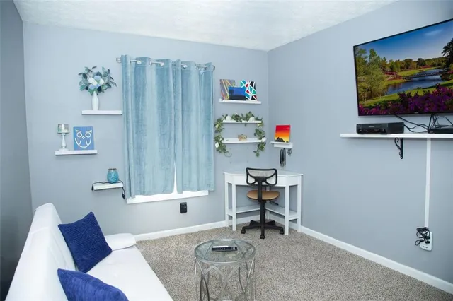 a workspace with furniture and wooden floor