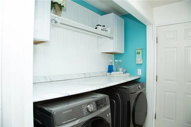 a utility room with dryer and washer