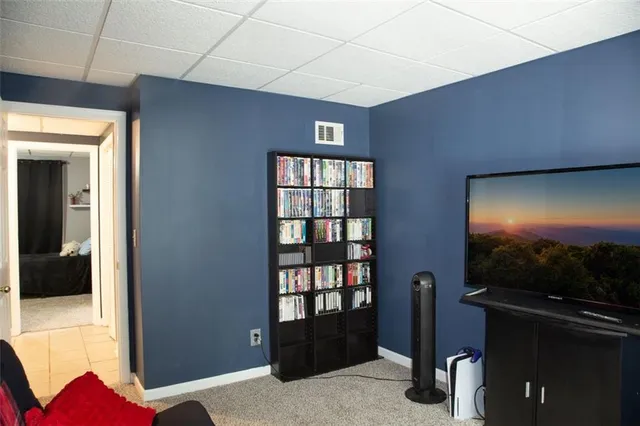 a view of livingroom with furniture and staircase