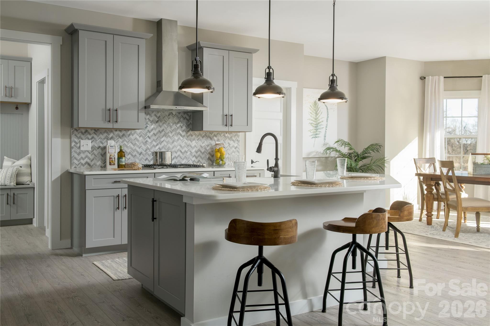 2 Pinnacle Way, Unit COVINGTON York, SC 29745 - Photo 14 of 46 a kitchen with stainless steel appliances a sink a stove a dining table and chairs