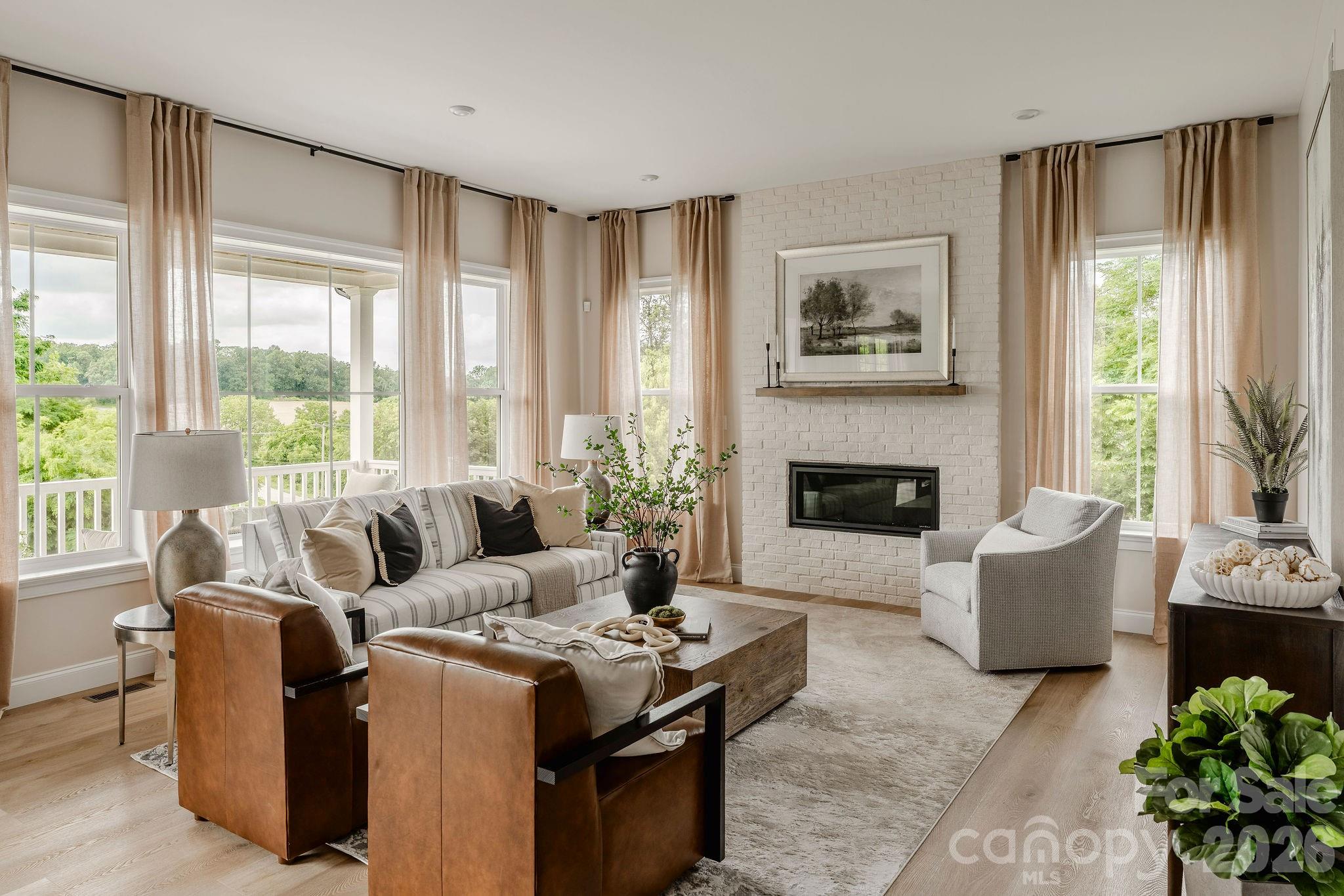 2 Pinnacle Way, Unit COVINGTON York, SC 29745 - Photo 16 of 46 a living room with furniture and a fireplace