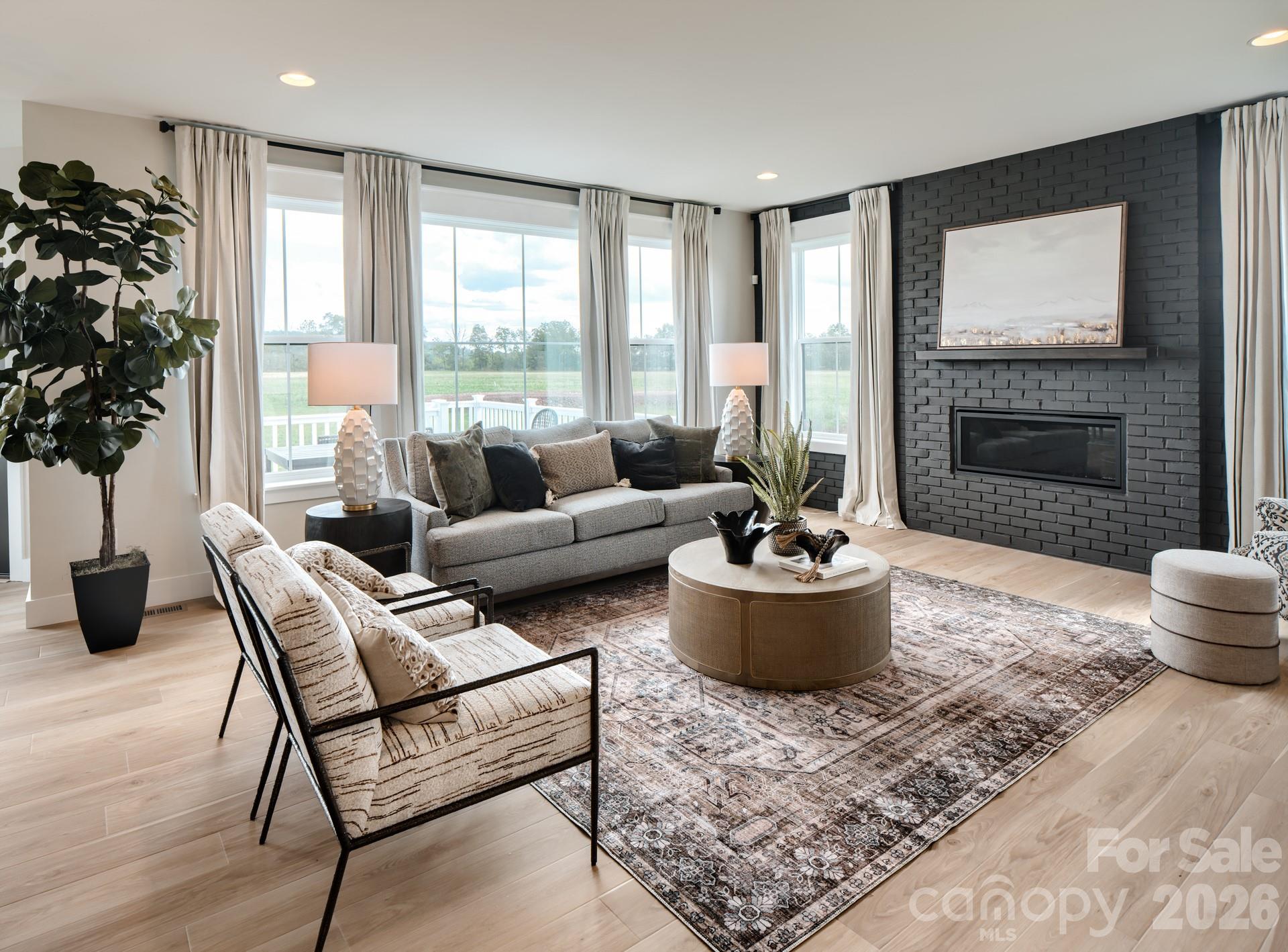 2 Pinnacle Way, Unit COVINGTON York, SC 29745 - Photo 18 of 46 a living room with furniture and a potted plant