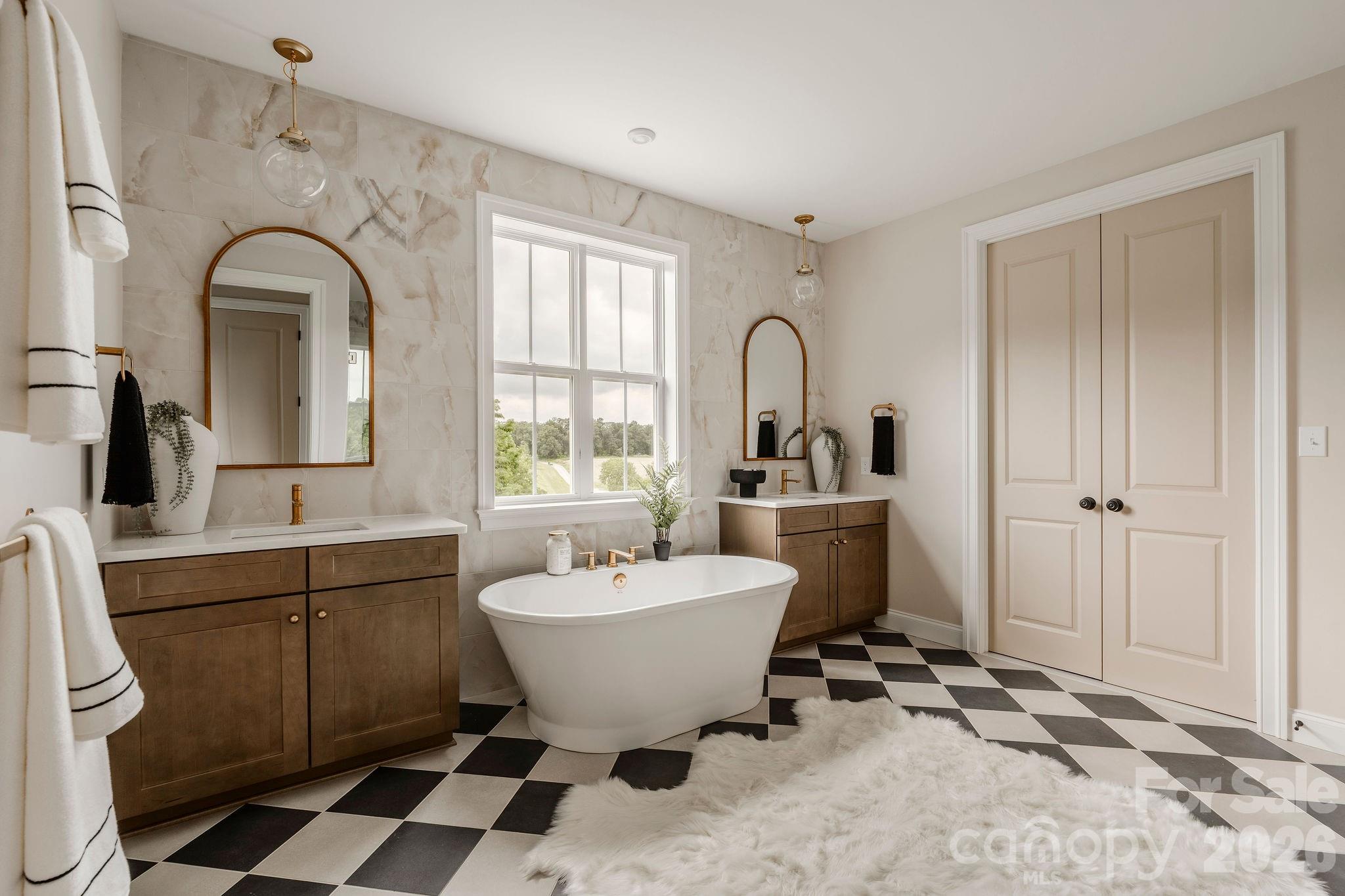 2 Pinnacle Way, Unit COVINGTON York, SC 29745 - Photo 31 of 46 a view of a bathroom with a sink and mirror