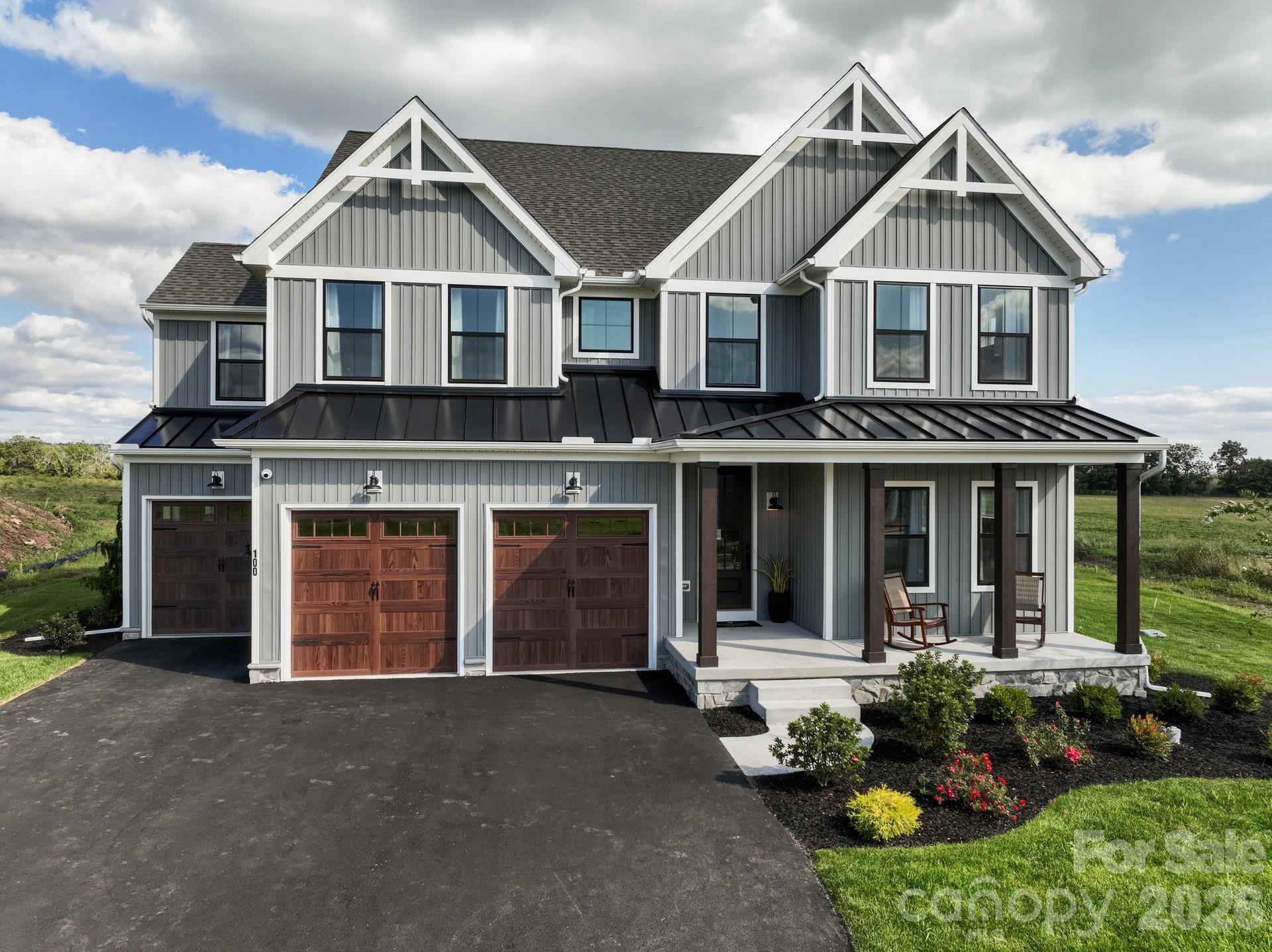 2 Pinnacle Way, Unit COVINGTON York, SC 29745 - Photo 6 of 46 a front view of a house with a yard and garage