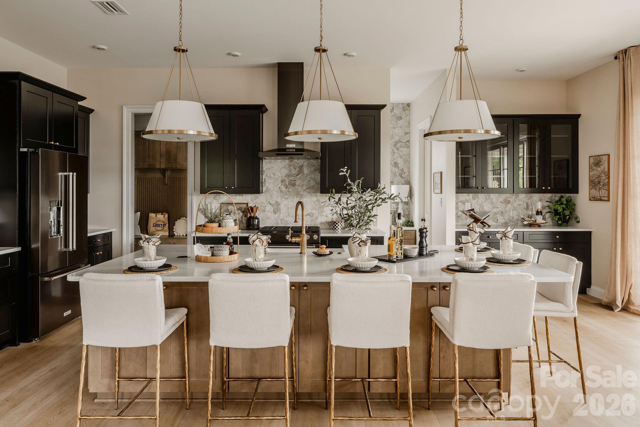 2 Pinnacle Way, Unit COVINGTON York, SC 29745 - Photo 9 of 46 a dining room with stainless steel appliances a table chairs a sink and a refrigerator