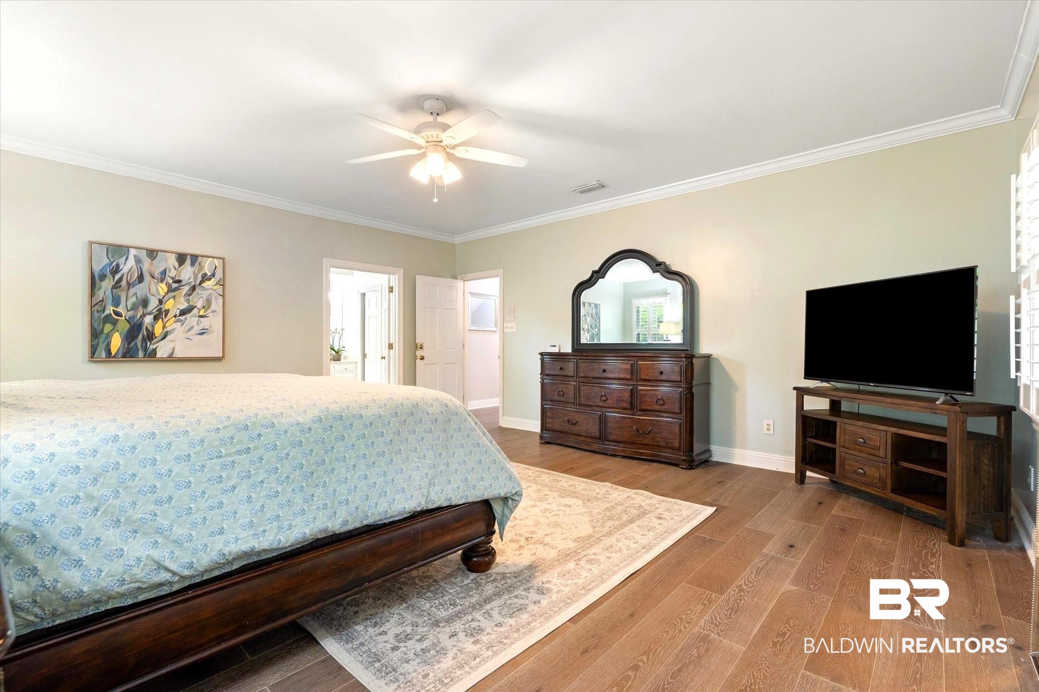 5324 Oak Bend Court Mobile, AL 36609 - Photo 23 of 49 Bedroom featuring visible vents, baseboards, crown molding, and wood finished floors
