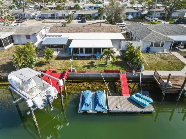 an aerial view of houses with outdoor space