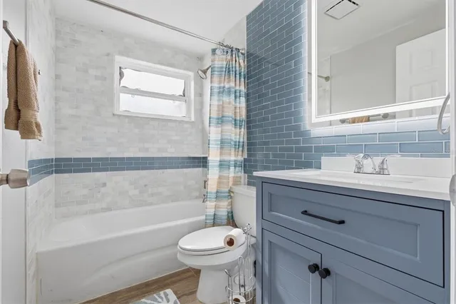 a dining room with furniture and a garden view