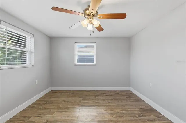 a dining room with furniture and floor to ceiling window
