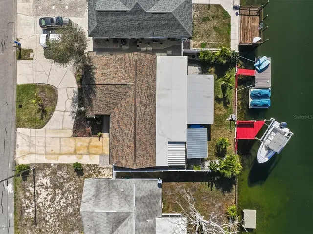 a view of a livingroom with a ceiling fan and window
