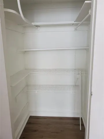a view of an empty walk in closet