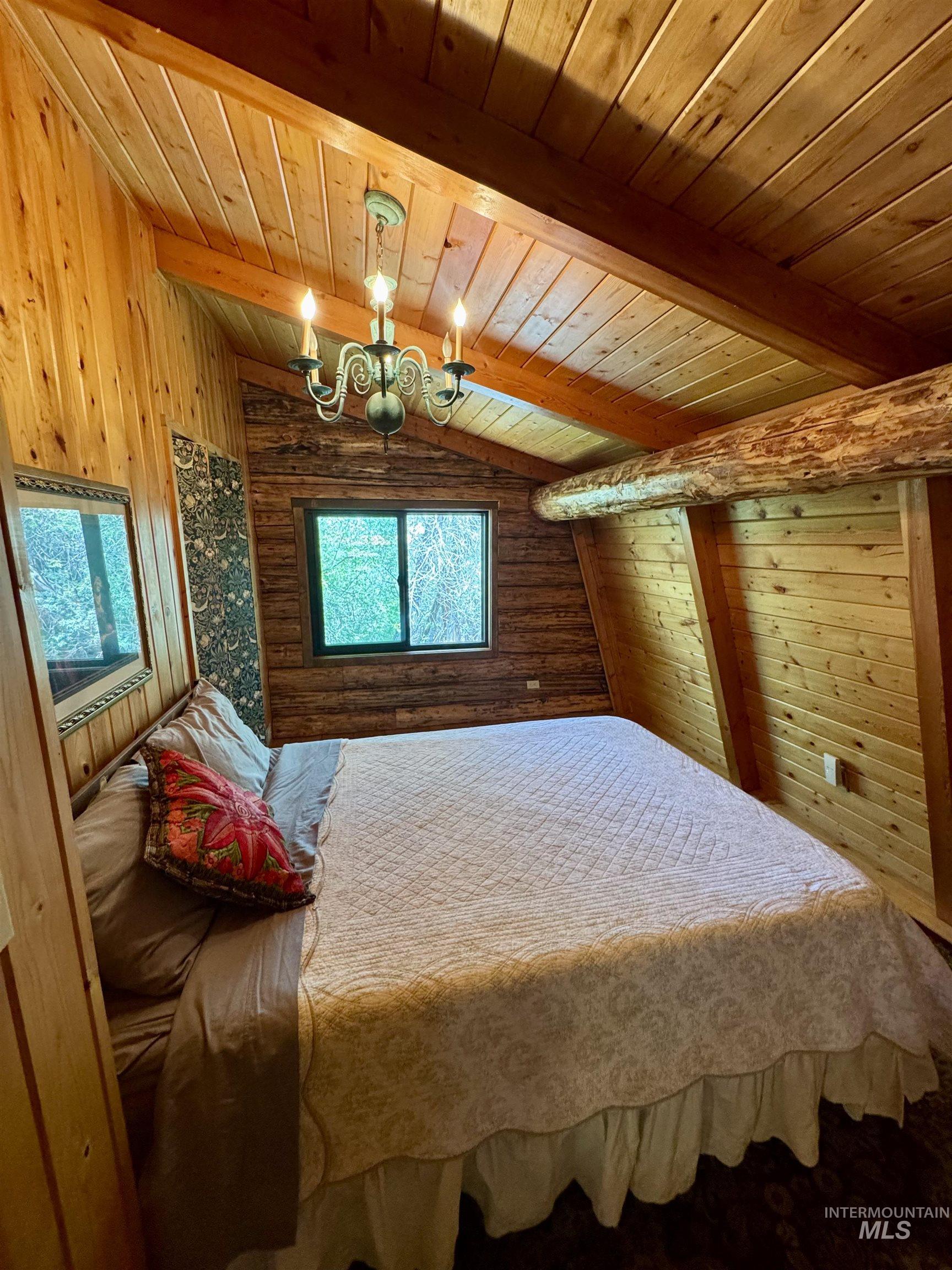 62 Bell Rapids Road Hagerman, ID 83332 - Photo 22 of 34 Sloped wood-paneled ceiling with exposed beams