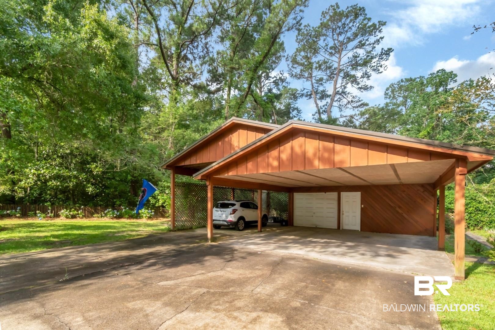 3212 Ward Road Mobile, AL 36605 - Photo 3 of 46 View of parking / parking lot with a garage and concrete driveway