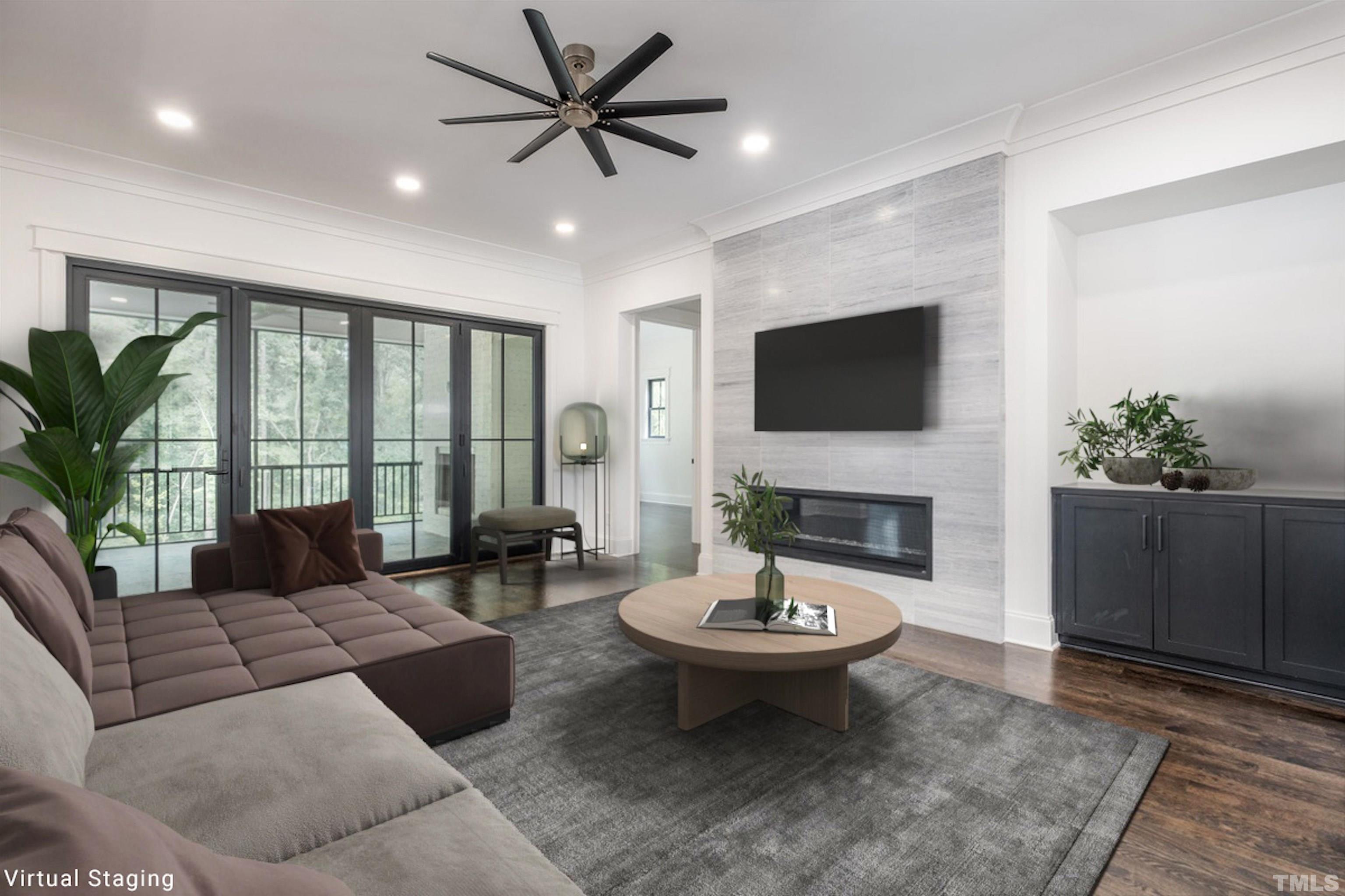 5011 Ten-Ten Road Apex, NC 27539 - Photo 19 of 49 a living room with furniture a fireplace and a flat screen tv
