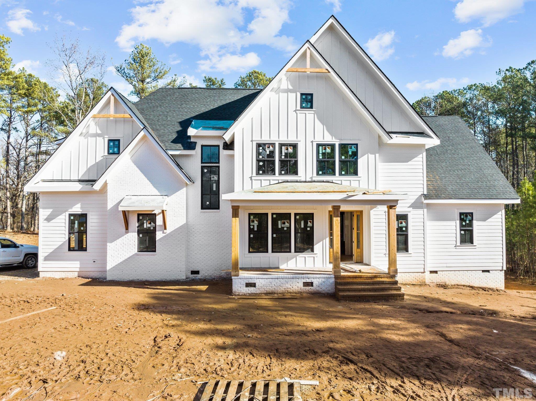 5011 Ten-Ten Road Apex, NC 27539 - Photo 2 of 49 a view of a white house with a yard
