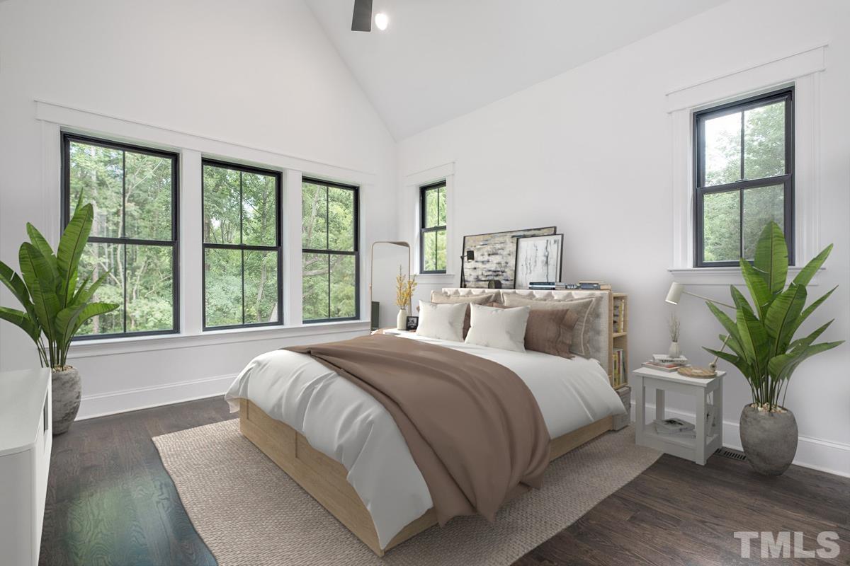 5011 Ten-Ten Road Apex, NC 27539 - Photo 23 of 49 a bedroom with a large bed and a large window