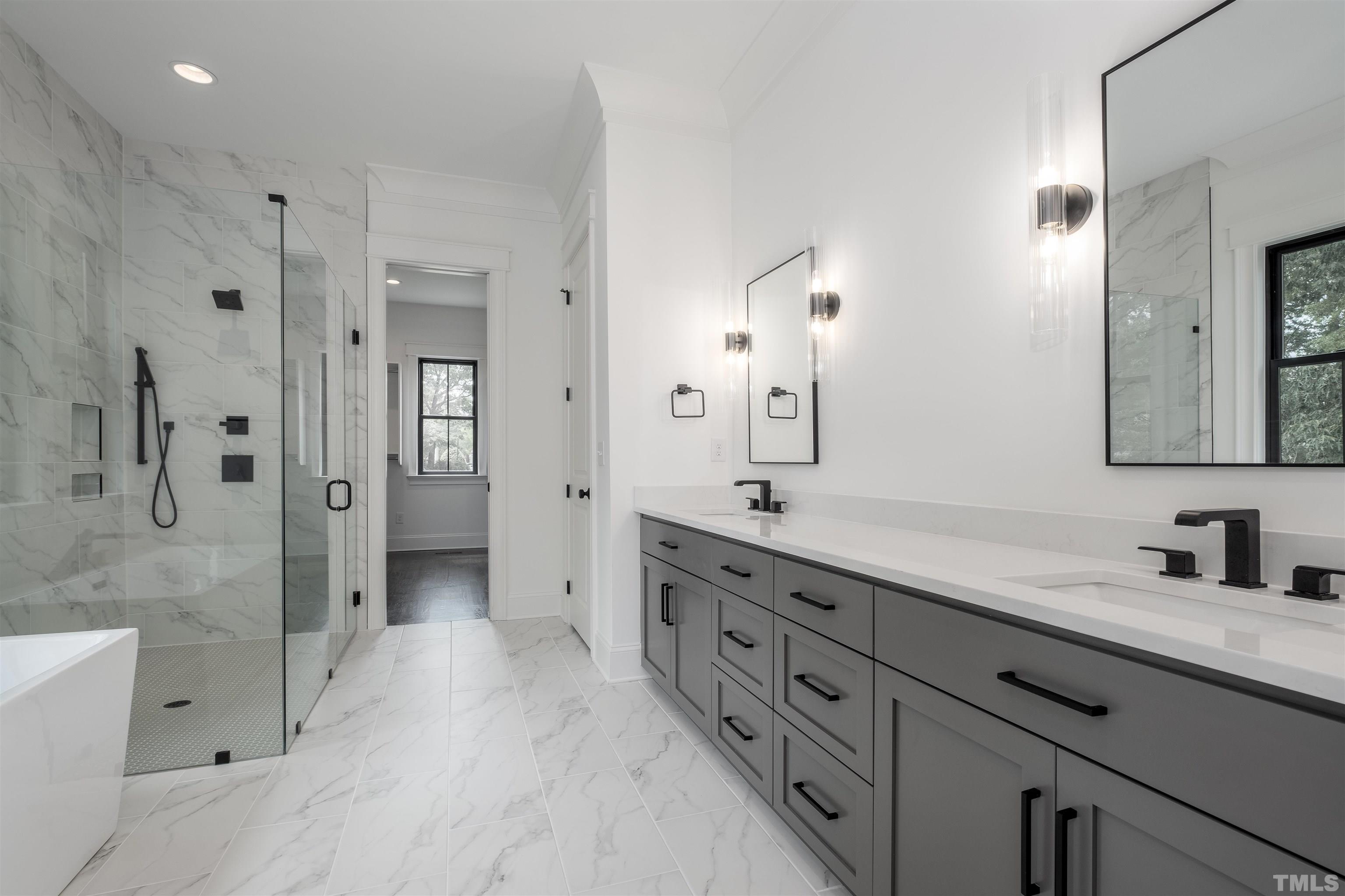 5011 Ten-Ten Road Apex, NC 27539 - Photo 27 of 49 a spacious bathroom with double sink shower and two mirror