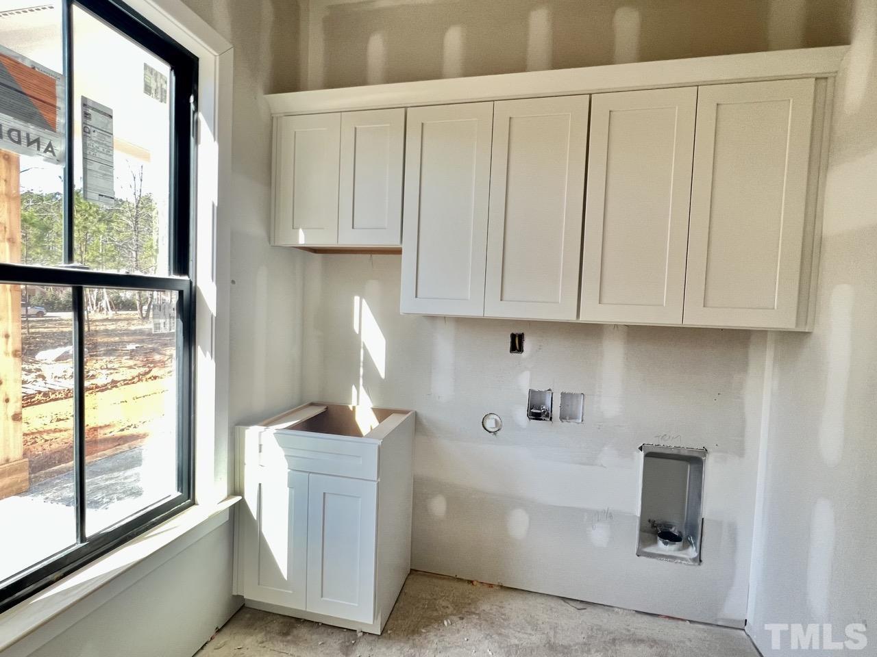 5011 Ten-Ten Road Apex, NC 27539 - Photo 29 of 49 a room with white cabinets and window