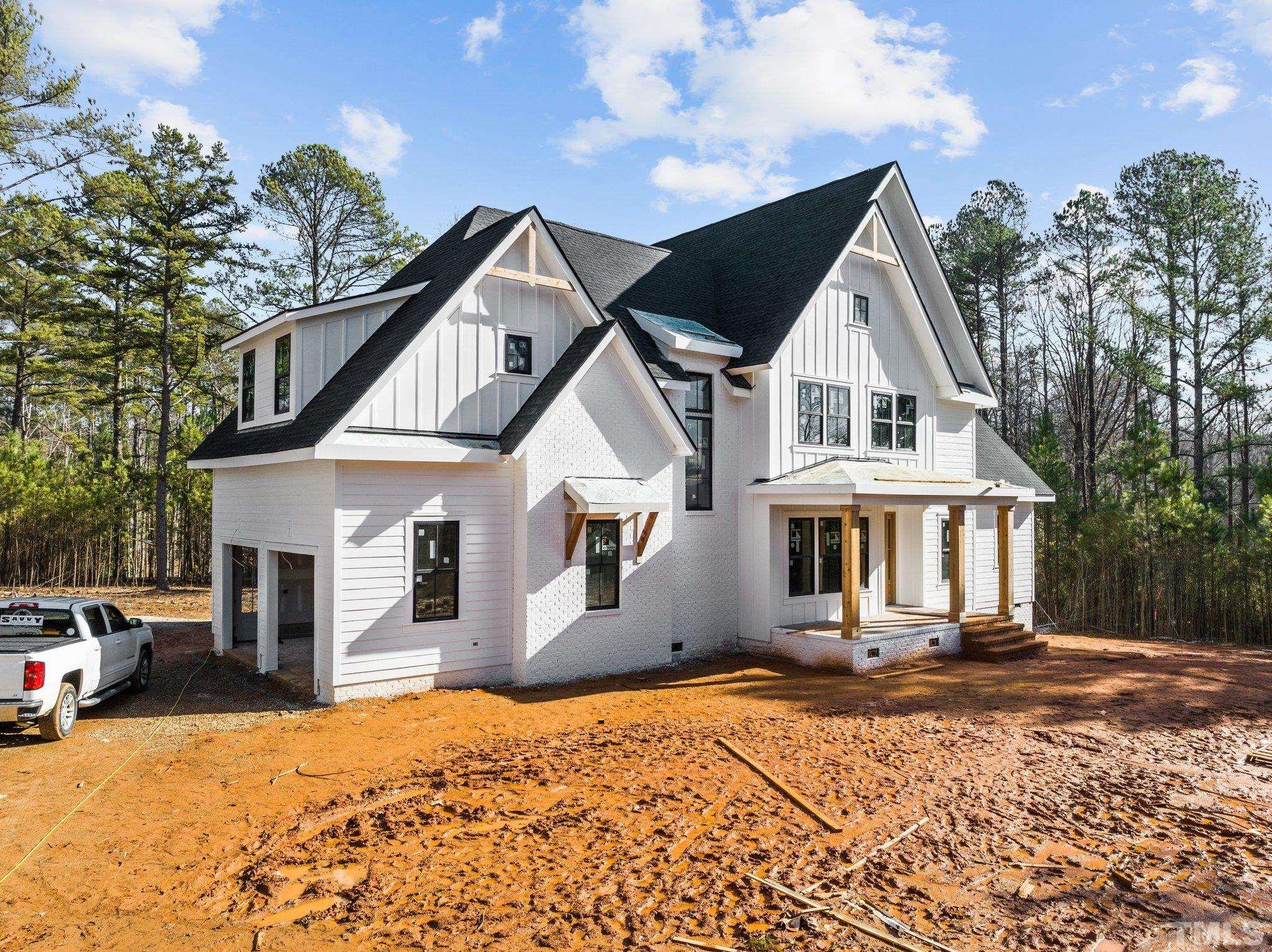 5011 Ten-Ten Road Apex, NC 27539 - Photo 5 of 49 a front view of a house with a yard