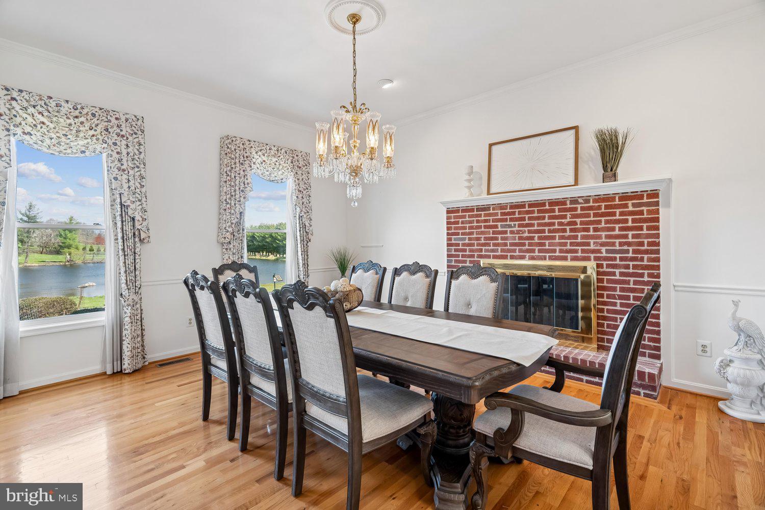 2950 Hobbs Road Glenwood, MD 21738 - Photo 13 of 82 a dining room with furniture a chandelier and wooden floor