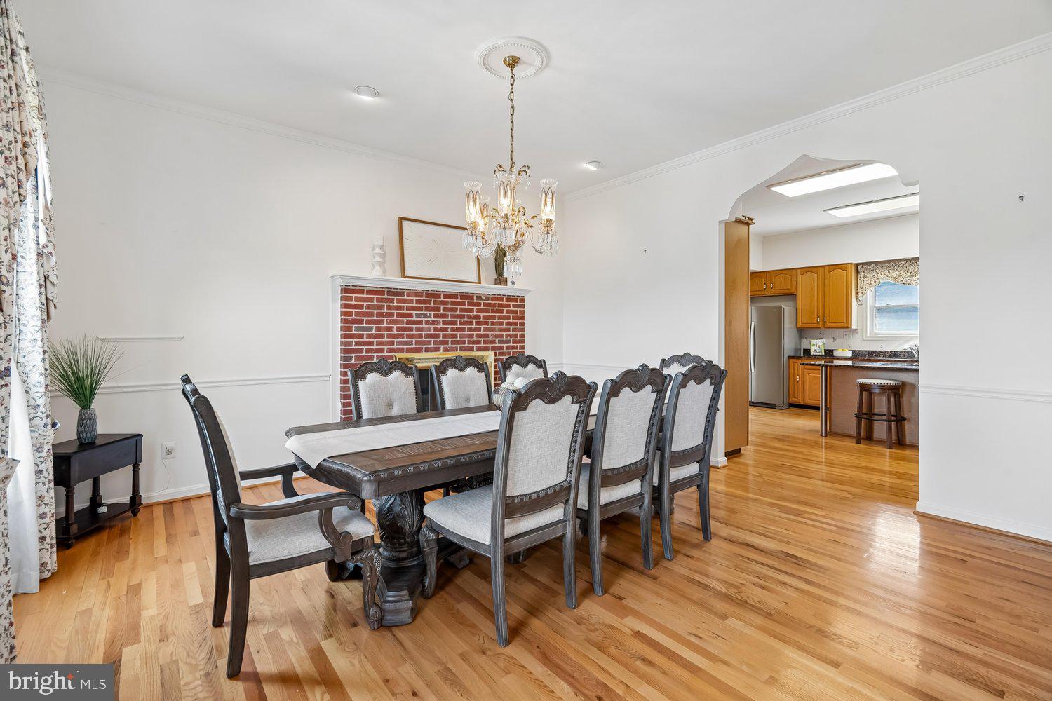 2950 Hobbs Road Glenwood, MD 21738 - Photo 14 of 82 a dining room with furniture a chandelier and wooden floor