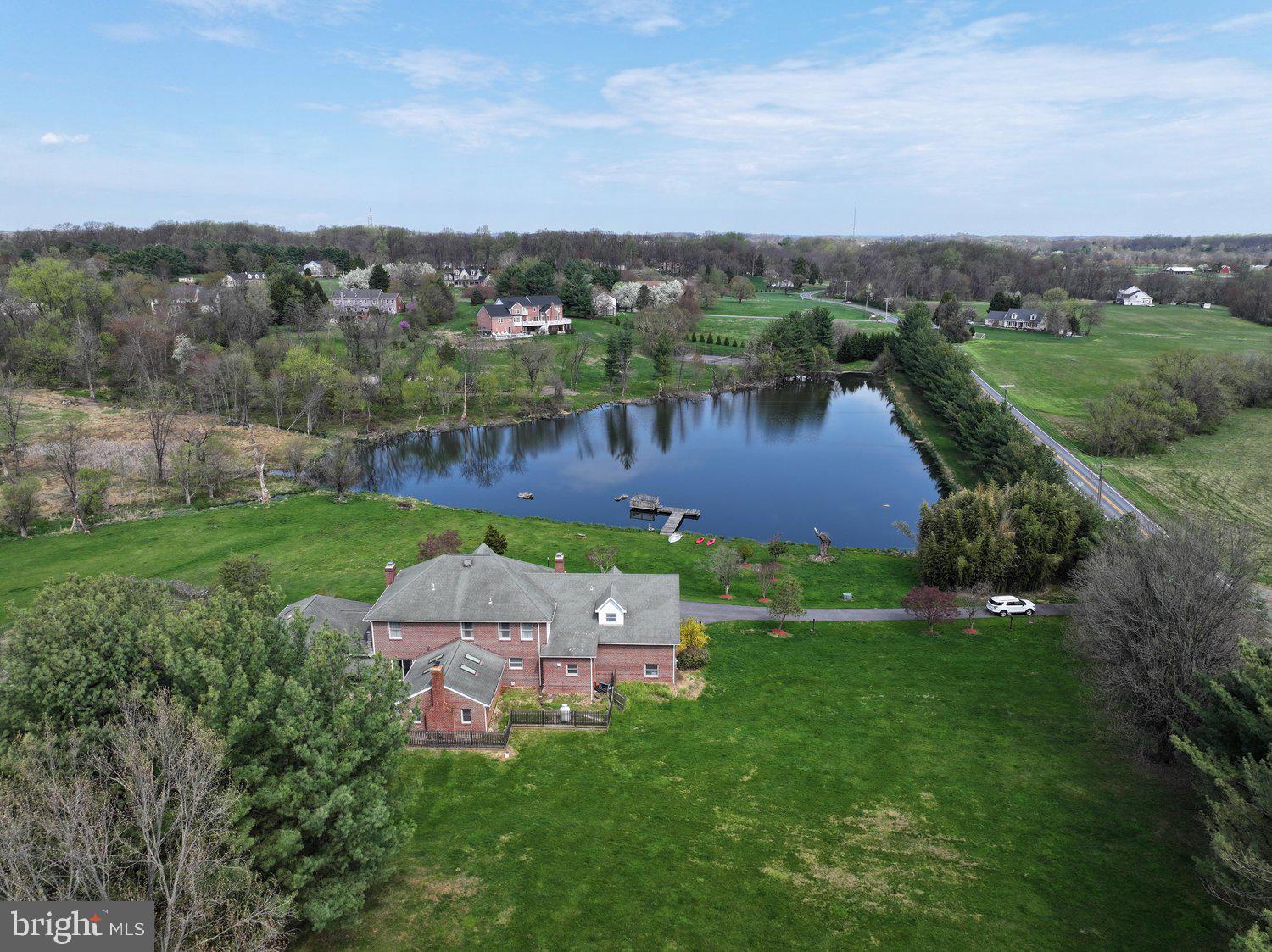 2950 Hobbs Road Glenwood, MD 21738 - Photo 3 of 82 an aerial view of a house with a garden and lake view