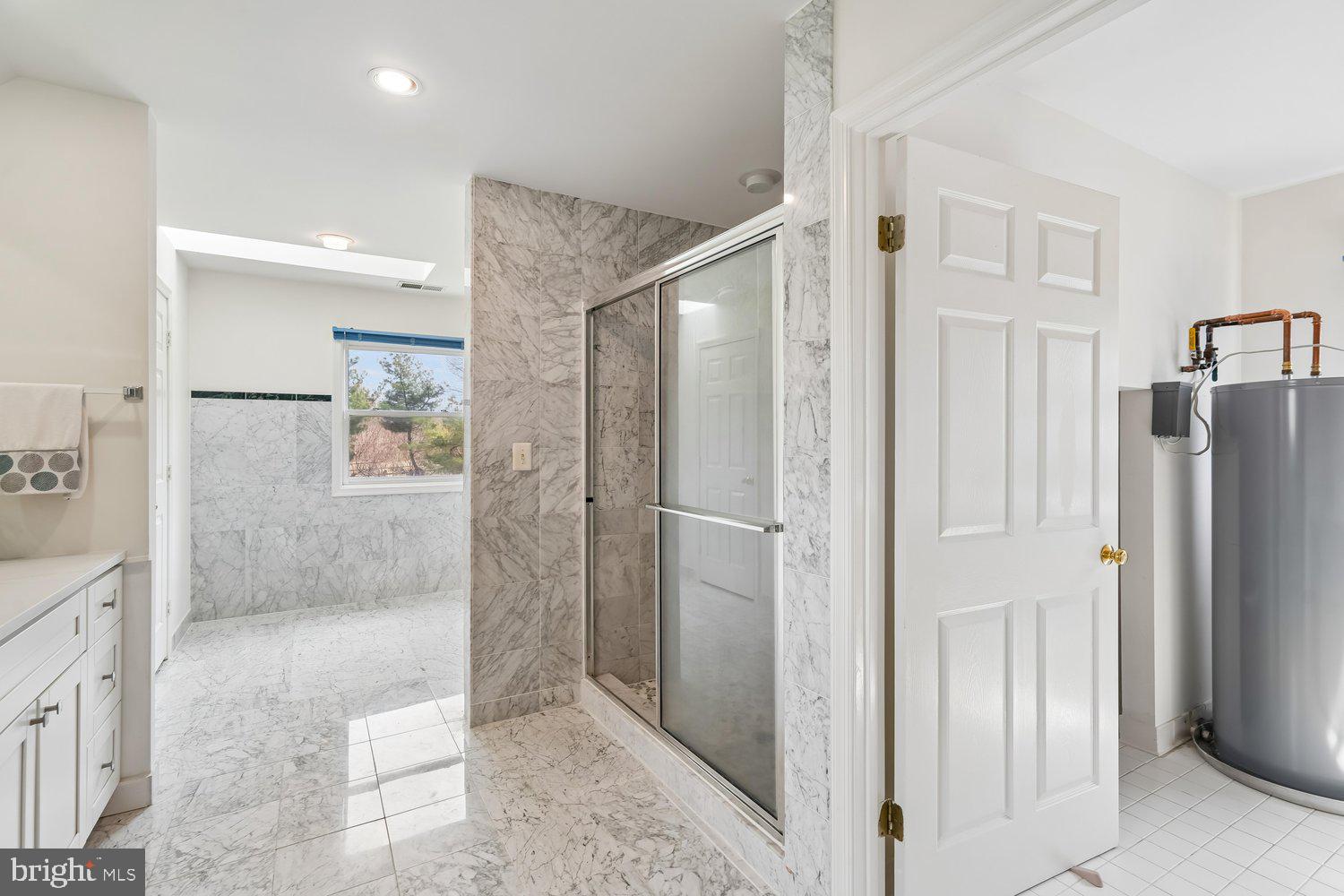 2950 Hobbs Road Glenwood, MD 21738 - Photo 32 of 82 a bathroom with a shower and a glass door