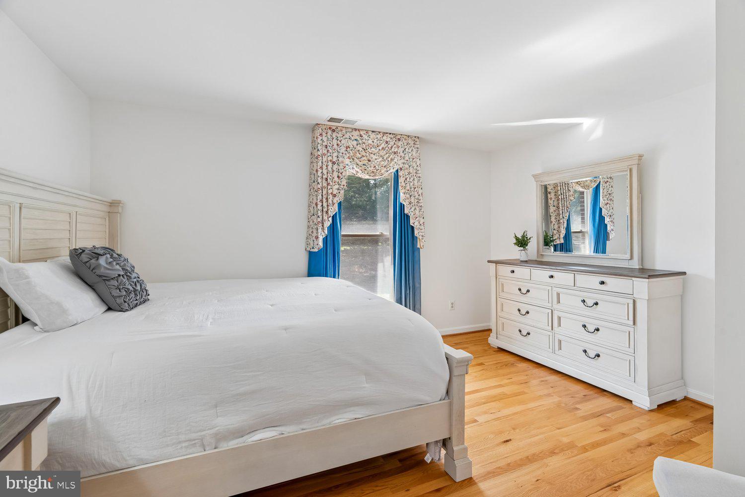 2950 Hobbs Road Glenwood, MD 21738 - Photo 38 of 82 a bedroom with a bed and a dresser in it