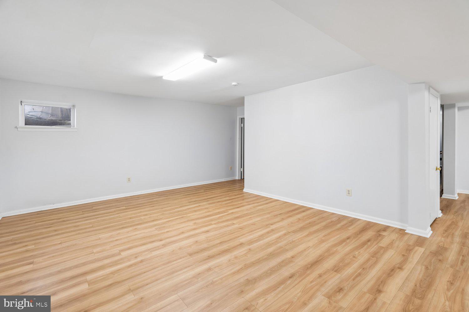 2950 Hobbs Road Glenwood, MD 21738 - Photo 45 of 82 a view of an empty room with wooden floor
