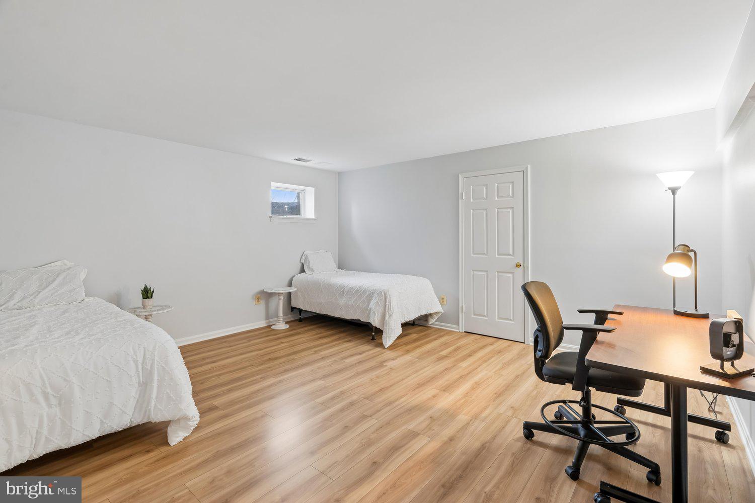 2950 Hobbs Road Glenwood, MD 21738 - Photo 48 of 82 a bedroom with a bed a table and a chair