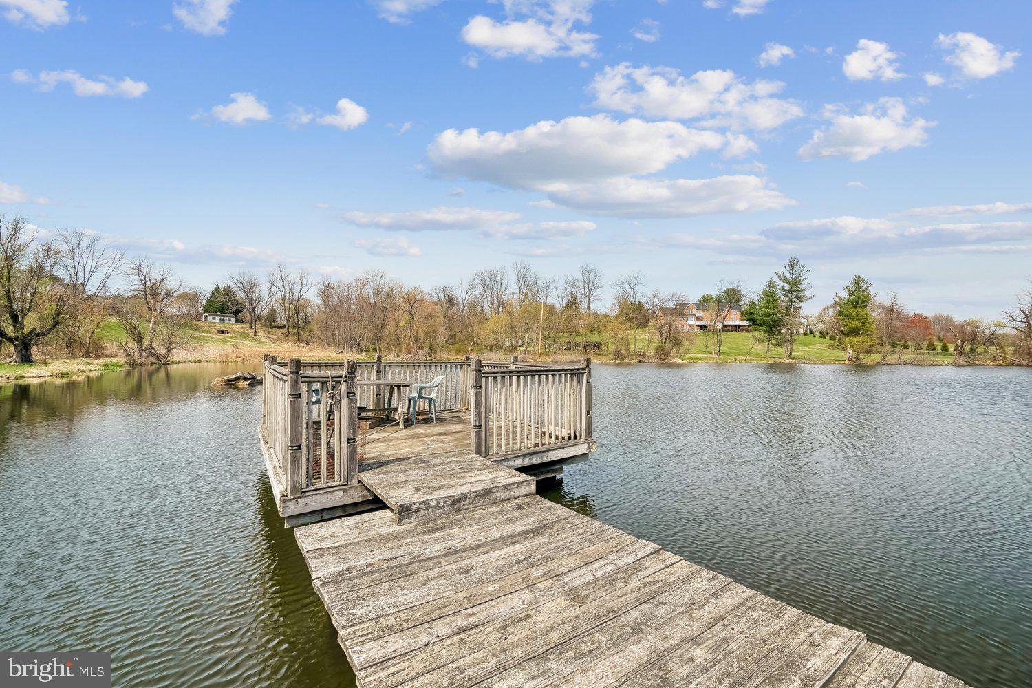 2950 Hobbs Road Glenwood, MD 21738 - Photo 61 of 82 a view of a lake with boats and trees in the background