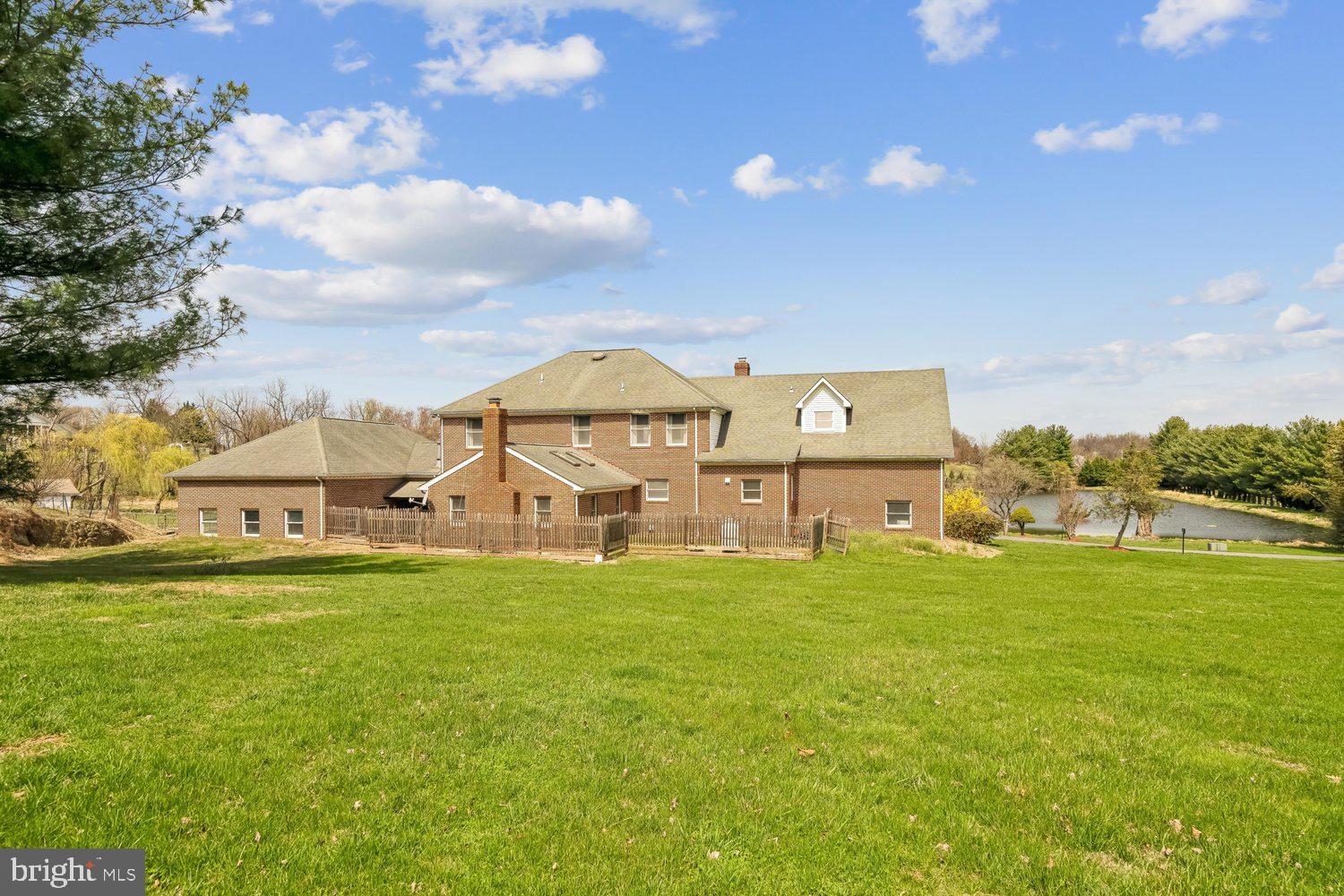 2950 Hobbs Road Glenwood, MD 21738 - Photo 68 of 82 a view of a big house with a big yard and large trees